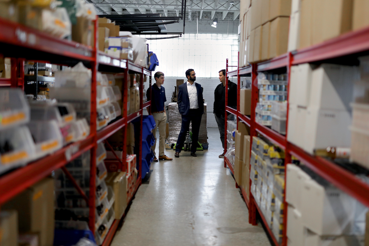 Ben Fritz and and Codal partners walking around the Cocktail Courier warehouse in Chicago, IL